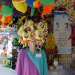 Picutre of a Cedar Point working wearing a bunch of SpongeBobs on her head